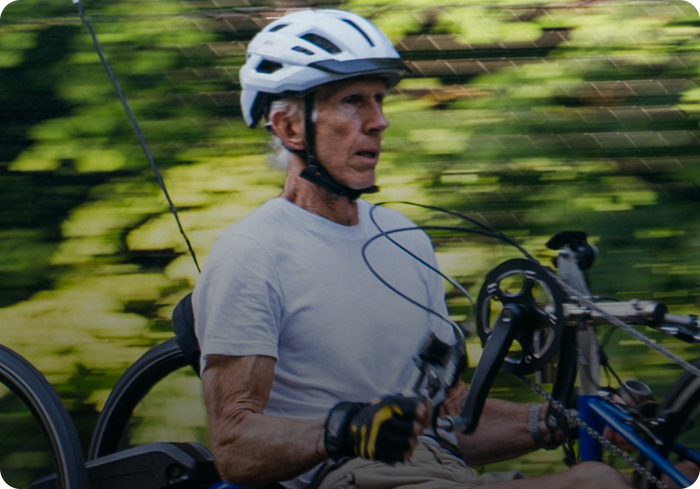 Rider wearing a helmet preparing for a personalized handcycle setup test ride
